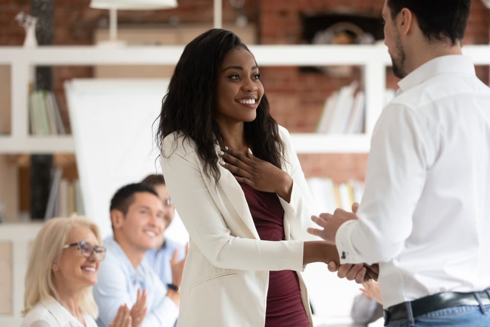 Happy,Black,Female,Employee,Get,Rewarded,For,Professional,Achievement,Handshake