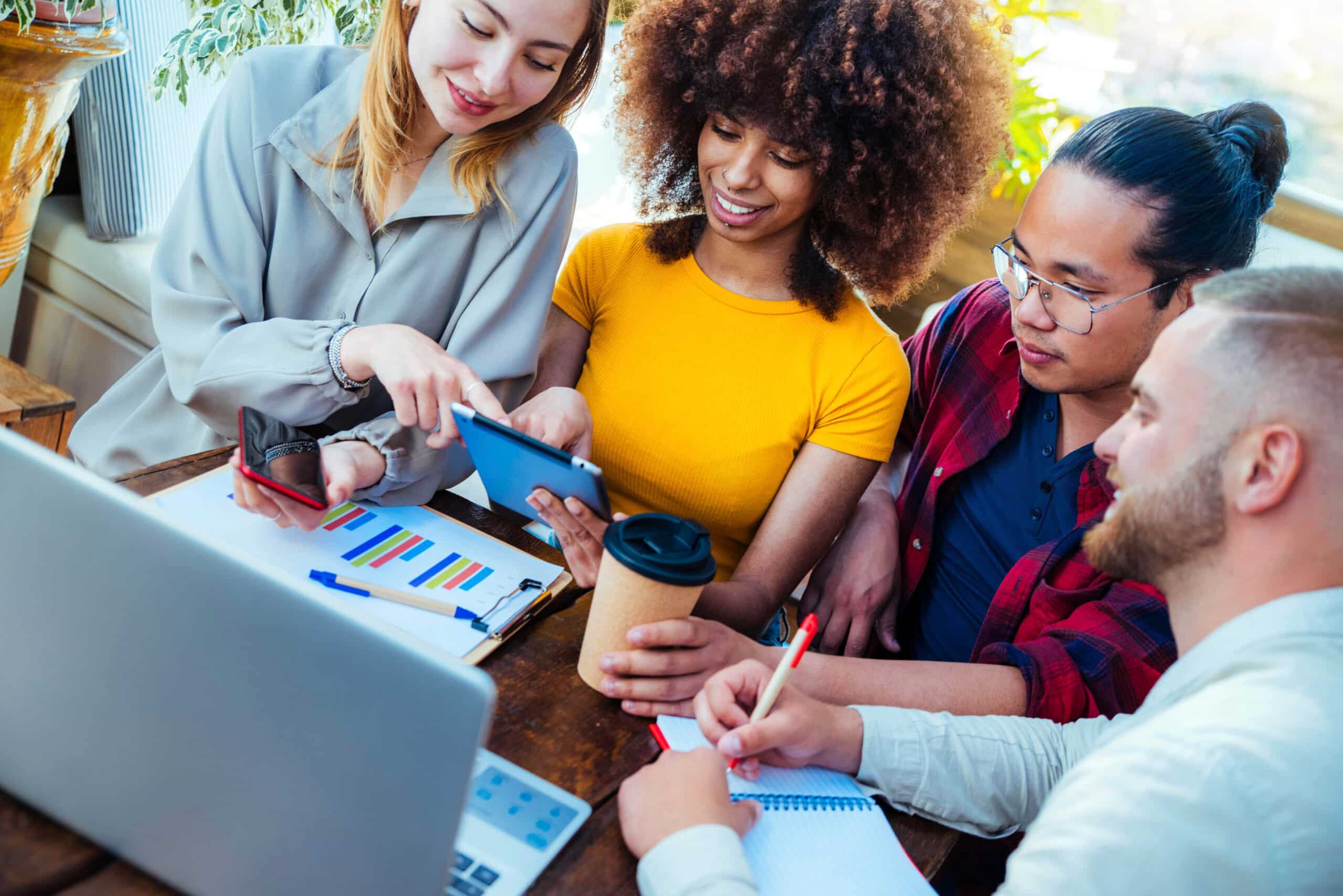 Multiracial,Diverse,Coworkers,Using,Tablet,Device,On,Creative,Office,-