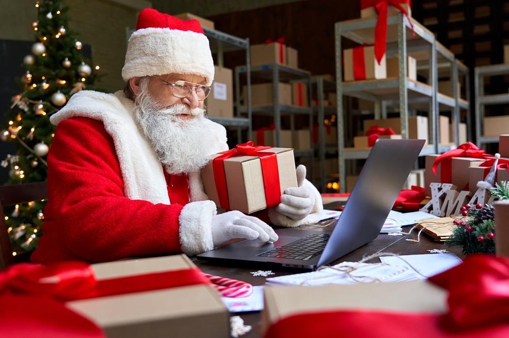 Happy,Old,Santa,Claus,Wearing,Costume,Holding,Gift,Box,Using