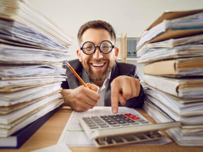 Funny,Smiling,Happy,Business,Man,In,Suit,And,Glasses,Working