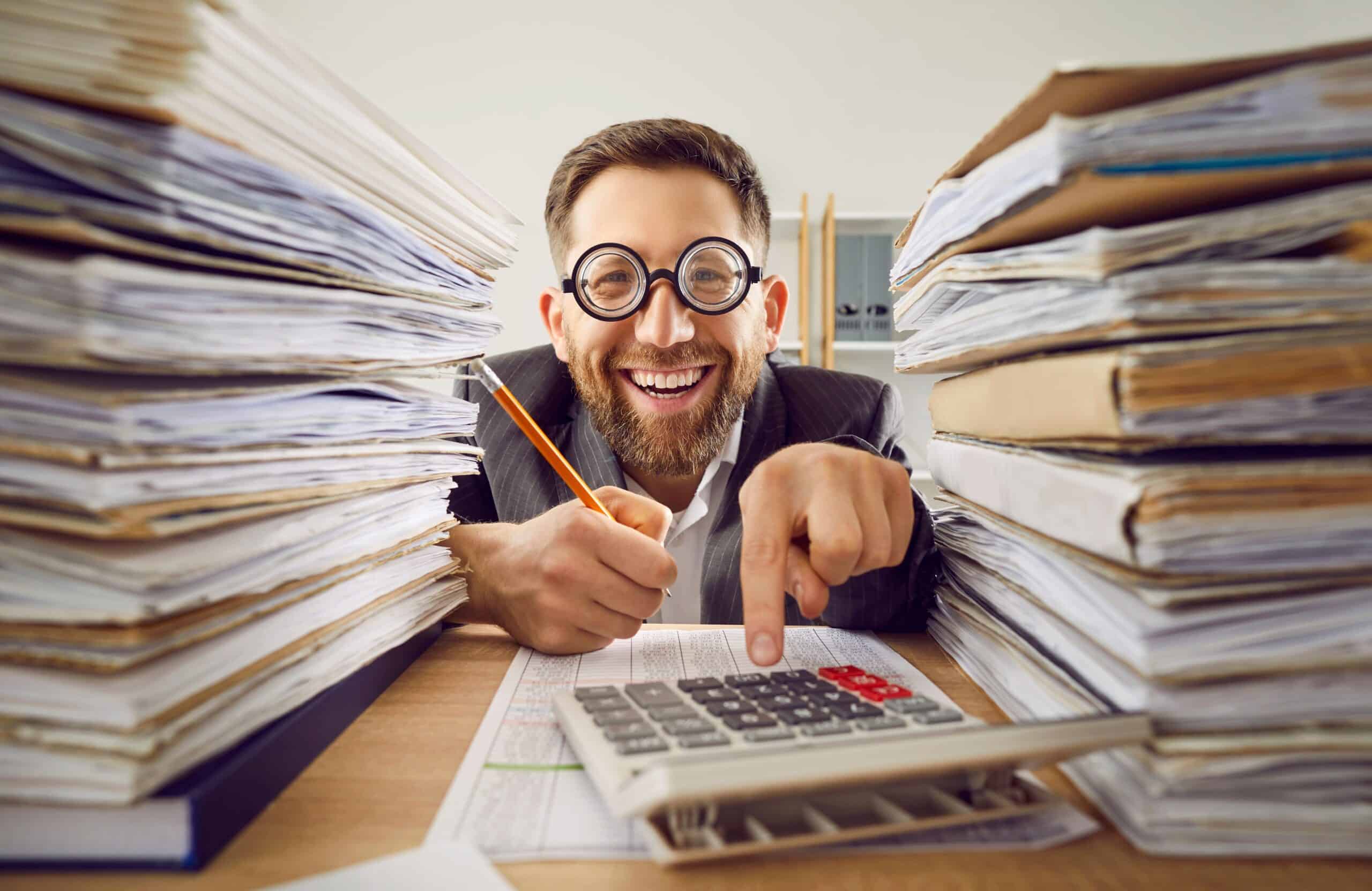 Funny,Smiling,Happy,Business,Man,In,Suit,And,Glasses,Working