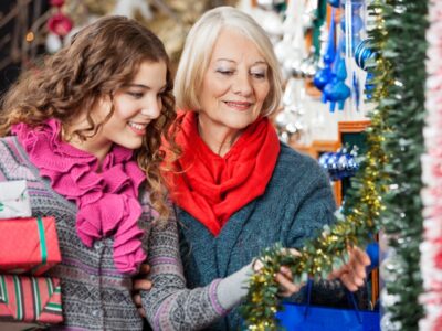 Beautiful,Mother,And,Daughter,Buying,Christmas,Decorations,In,Store