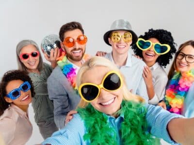 Diverse,Colleagues,In,Festive,Accessories,Smiling,Together,For,A,Celebratory