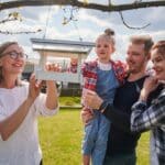 Cheerful,Senior,Woman,Putting,Bread,At,Birdhouse,While,Feeding,Birds